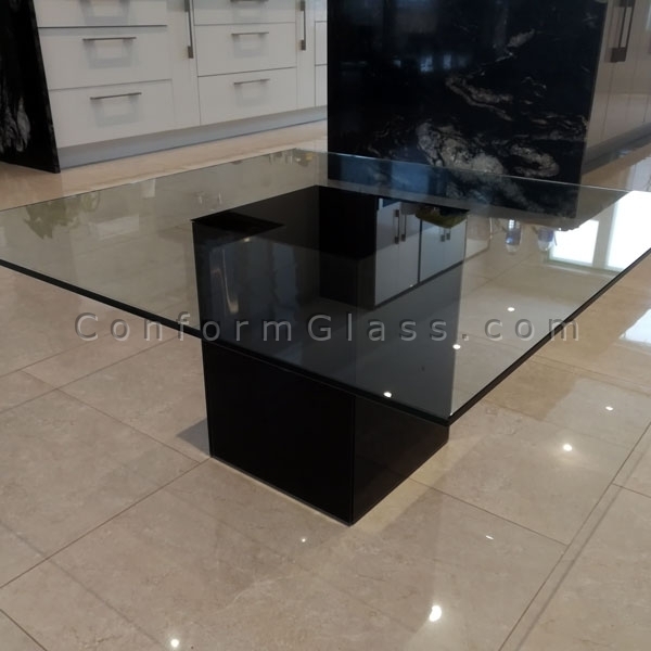 Coffee table with black back painted glass base