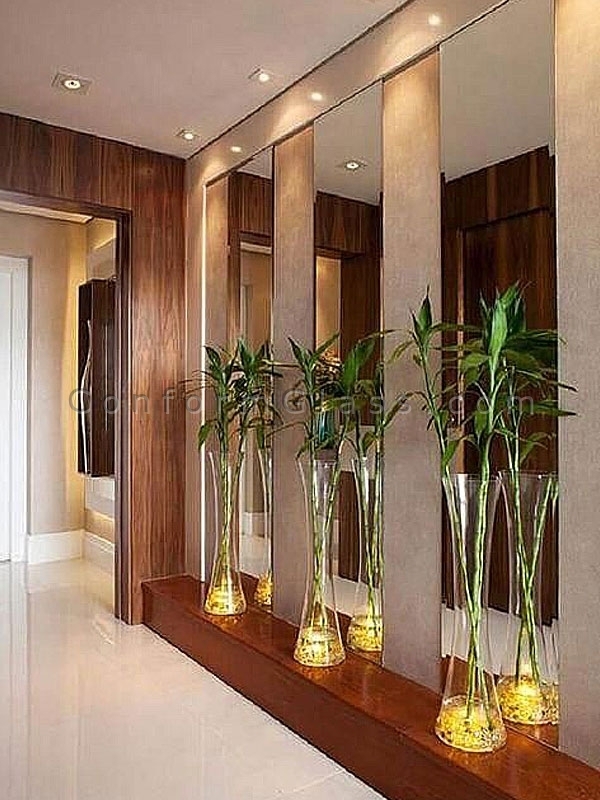Three long vertical mirrors at an entrance