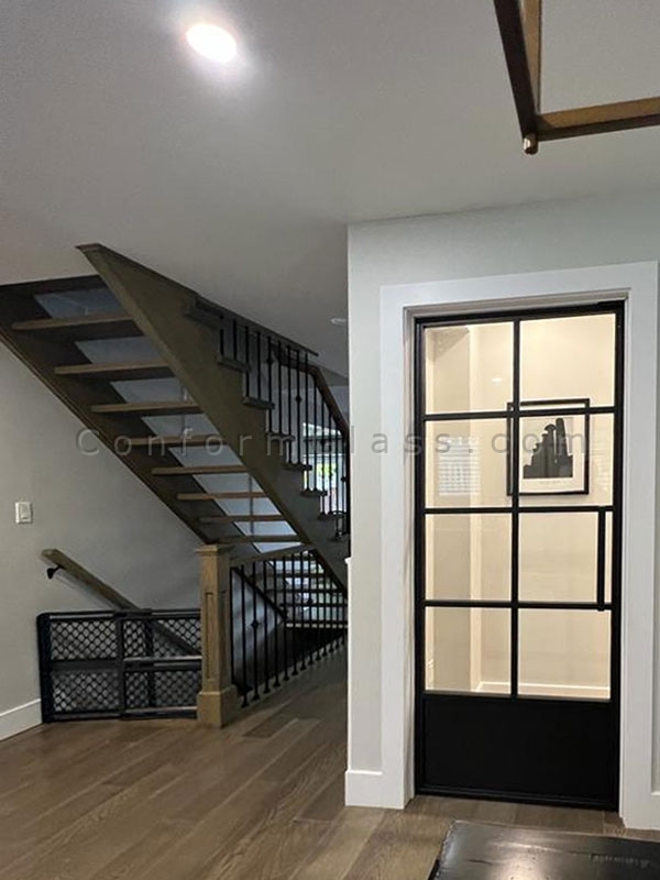 Glass door with welded steel frame